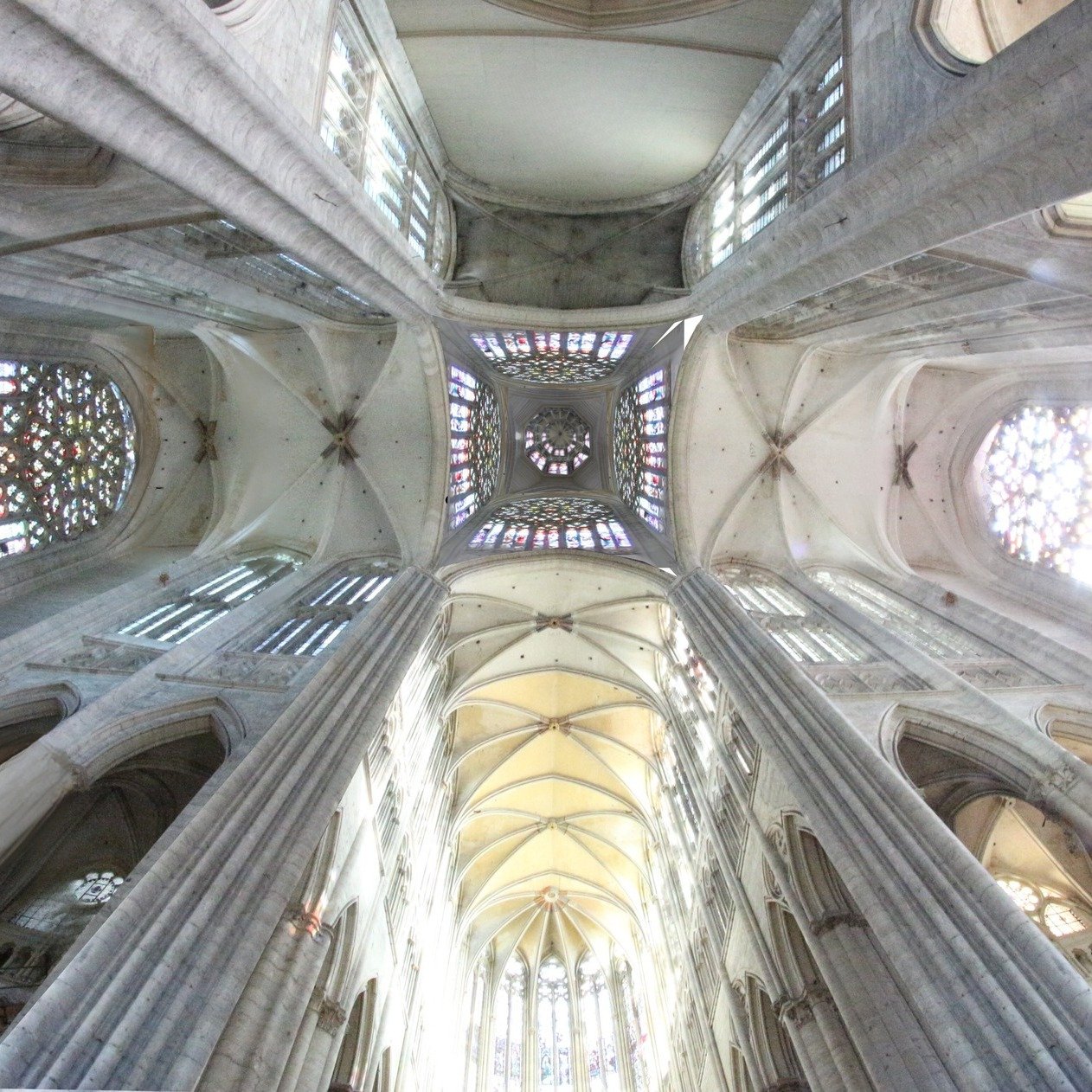 Photomontage showing the three tiers of stained glass inside the lantern tower of Beauvais Cathedral