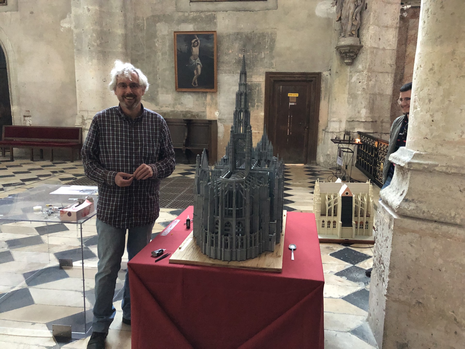 Pascal Hassé next to his model of the lantern tower of Beauvais Cathedral